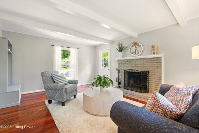 828 Dorsey Ln, Louisville, KY 40223 - living area featuring beam ceiling, wood finished floors, a brick fireplace, and baseboards