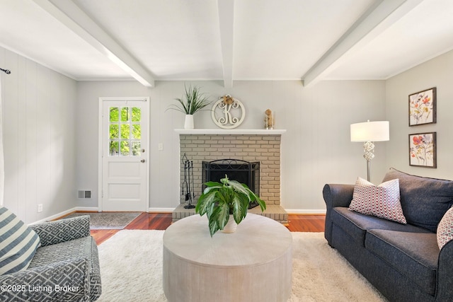 828 Dorsey Ln, Louisville, KY 40223 - living room with wood finished floors, beam ceiling, a fireplace, and baseboards