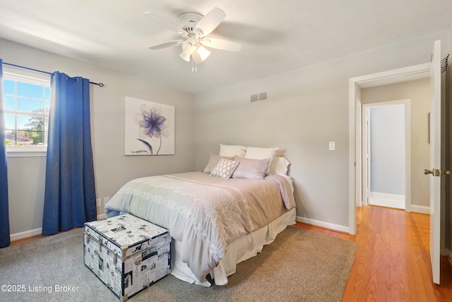 828 Dorsey Ln, Louisville, KY 40223 - bedroom with light wood-style flooring, baseboards, and ceiling fan