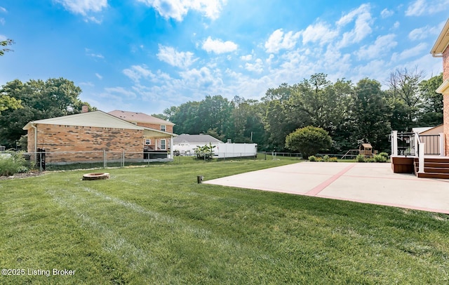 1311 Pollitt Ct, Louisville, KY 40223 - view of yard featuring a fire pit, a patio area, and a deck