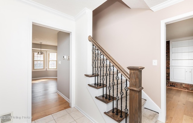 1311 Pollitt Ct, Louisville, KY 40223 - stairway with ornamental molding, wood finished floors, and baseboards