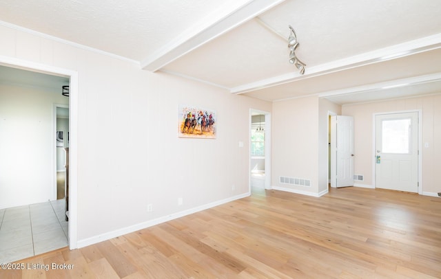 1311 Pollitt Ct, Louisville, KY 40223 - spare room featuring light wood finished floors, healthy amount of natural light, beamed ceiling, crown molding, and baseboards