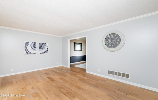1311 Pollitt Ct, Louisville, KY 40223 - unfurnished room featuring a textured ceiling, baseboards, light wood-style floors, and ornamental molding