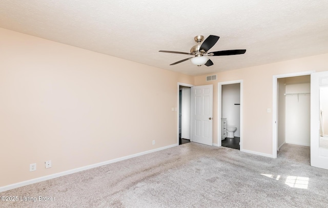 1311 Pollitt Ct, Louisville, KY 40223 - unfurnished bedroom with carpet floors, baseboards, connected bathroom, a spacious closet, and a closet