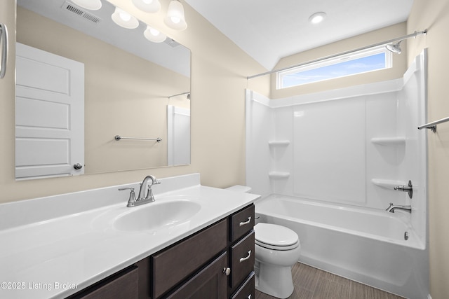 10516 Vista View Dr, Louisville, KY 40291 - bathroom featuring vanity, toilet, bathtub / shower combination, vaulted ceiling, and wood finished floors
