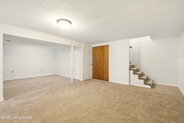 9809 Tiverton Way, Louisville, KY 40242 - finished basement featuring light carpet, stairs, baseboards, and a textured ceiling