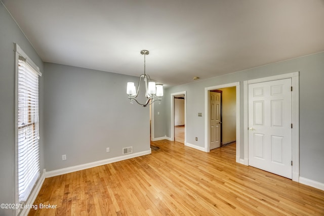 1124 Foxfire Rd, Bardstown, KY 40004 - spare room with a chandelier and light wood finished floors