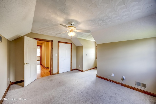 1124 Foxfire Rd, Bardstown, KY 40004 - unfurnished bedroom featuring vaulted ceiling, light carpet, and ceiling fan