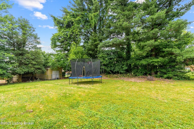 4908 Kay Ave, Louisville, KY 40299 - view of grassy yard featuring a trampoline