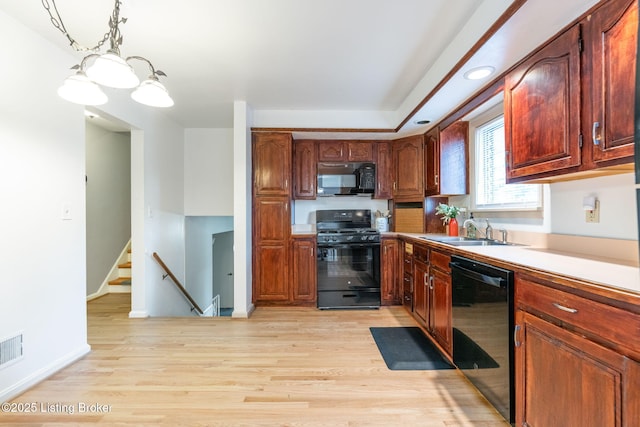 4908 Kay Ave, Louisville, KY 40299 - kitchen featuring black appliances, a sink, light wood-style floors, pendant lighting, and recessed lighting