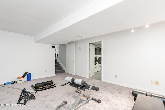 4908 Kay Ave, Louisville, KY 40299 - exercise area featuring washing machine and clothes dryer, crown molding, carpet floors, and baseboards