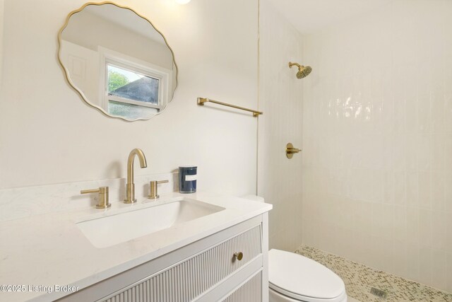 5115 Stony Brook Dr, Louisville, KY 40291 - full bathroom with toilet, a tile shower, and vanity