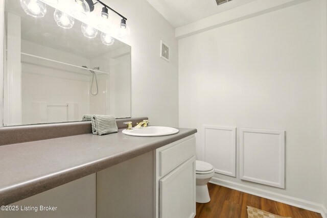 5115 Stony Brook Dr, Louisville, KY 40291 - bathroom featuring toilet, a shower, vanity, and wood finished floors