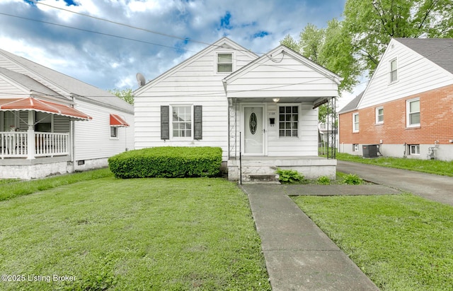 1108 Dresden Ave, Louisville, KY 40215 - view of front of home with covered porch, cooling unit, and a front lawn