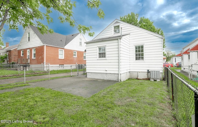 1108 Dresden Ave, Louisville, KY 40215 - rear view of house with central AC and a patio