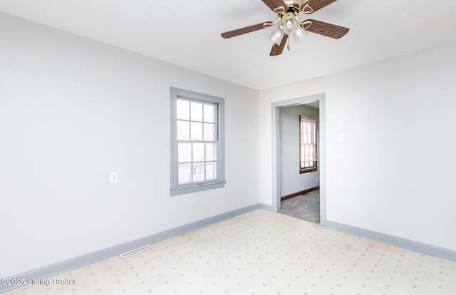 1108 Dresden Ave, Louisville, KY 40215 - empty room featuring baseboards, a ceiling fan, and light carpet