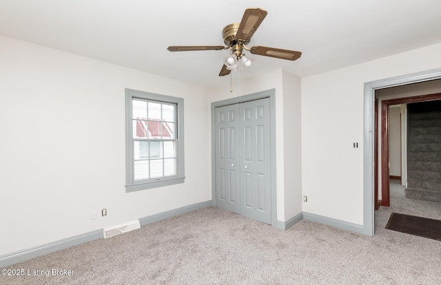 1108 Dresden Ave, Louisville, KY 40215 - unfurnished bedroom featuring carpet floors, baseboards, a closet, and a ceiling fan