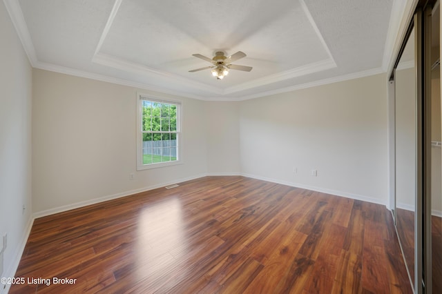 9400 Minute Men Ct, Louisville, KY 40214 - empty room featuring a raised ceiling, a ceiling fan, wood finished floors, baseboards, and ornamental molding