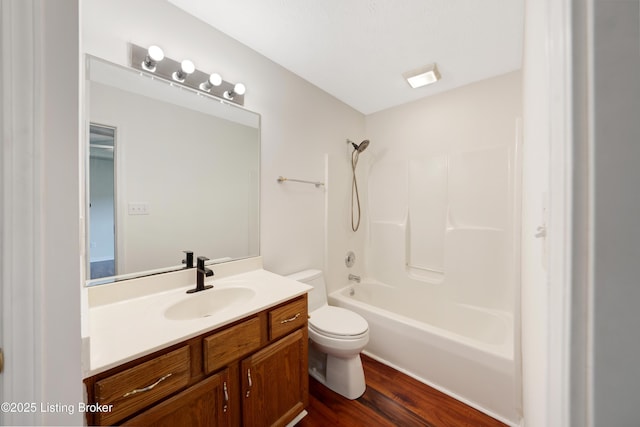 9400 Minute Men Ct, Louisville, KY 40214 - bathroom featuring toilet, vanity, wood finished floors, and  shower combination