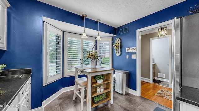 5531 Forest Lake Dr, Prospect, KY 40059 - dining space featuring a textured ceiling and baseboards