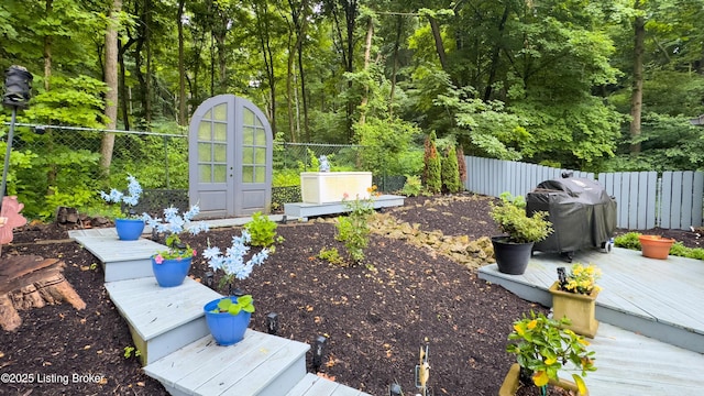 5531 Forest Lake Dr, Prospect, KY 40059 - fenced backyard with a wooden deck and a wooded view