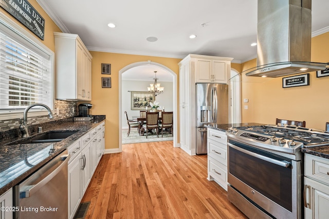 15323 Royal Troon Ave, Louisville, KY 40245 - kitchen with appliances with stainless steel finishes, island exhaust hood, a sink, crown molding, and a chandelier