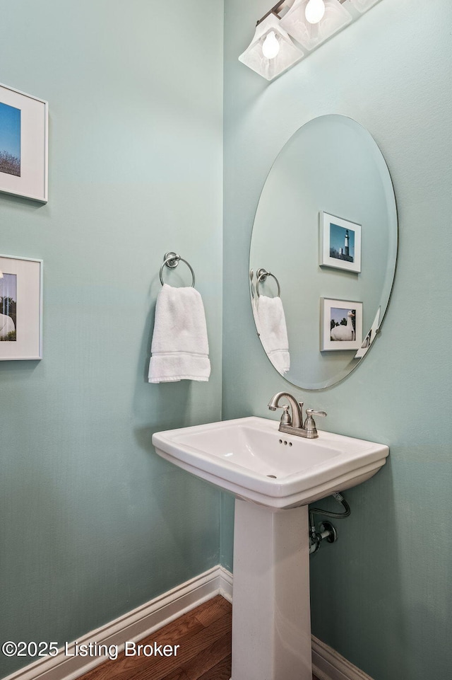 15323 Royal Troon Ave, Louisville, KY 40245 - bathroom with wood finished floors, a sink, and baseboards
