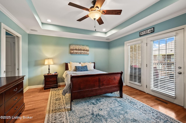 15323 Royal Troon Ave, Louisville, KY 40245 - bedroom featuring access to outside, a raised ceiling, wood finished floors, baseboards, and recessed lighting