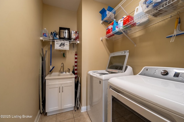 15323 Royal Troon Ave, Louisville, KY 40245 - washroom with washer and clothes dryer, cabinet space, light tile patterned floors, and baseboards
