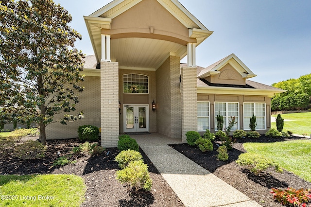 15323 Royal Troon Ave, Louisville, KY 40245 - entrance to property with french doors, brick siding, a yard, and roof with shingles