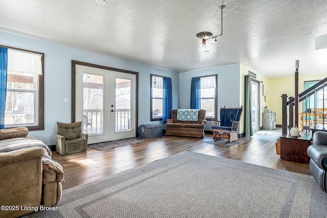 3412 Boyds Knob Rd, Munfordville, KY 42765 - living area featuring hardwood / wood-style flooring, french doors, and stairway
