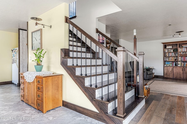 3412 Boyds Knob Rd, Munfordville, KY 42765 - staircase with baseboards and a textured ceiling