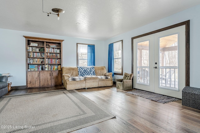 3412 Boyds Knob Rd, Munfordville, KY 42765 - living room with french doors, hardwood / wood-style flooring, and a textured ceiling