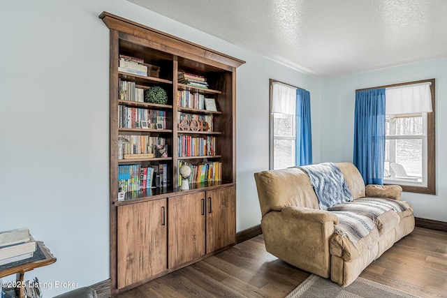 3412 Boyds Knob Rd, Munfordville, KY 42765 - sitting room with dark wood-style floors and baseboards