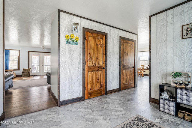 3412 Boyds Knob Rd, Munfordville, KY 42765 - entrance foyer with a textured ceiling, baseboards, french doors, and wallpapered walls