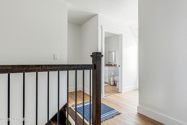 3412 Boyds Knob Rd, Munfordville, KY 42765 - staircase featuring wood finished floors and baseboards