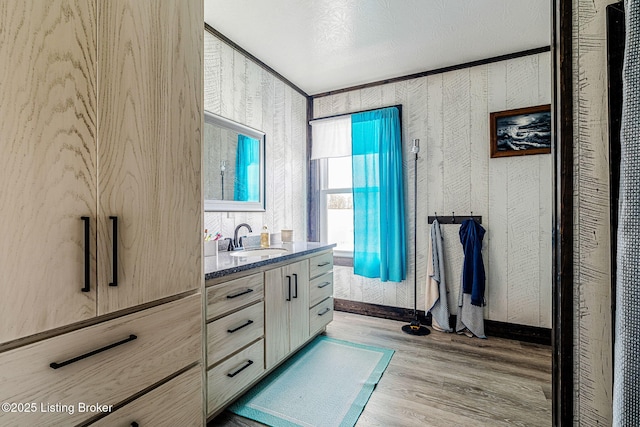 3412 Boyds Knob Rd, Munfordville, KY 42765 - bathroom with vanity, wood finished floors, and wallpapered walls