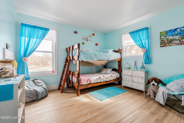 3412 Boyds Knob Rd, Munfordville, KY 42765 - bedroom with multiple windows and wood finished floors