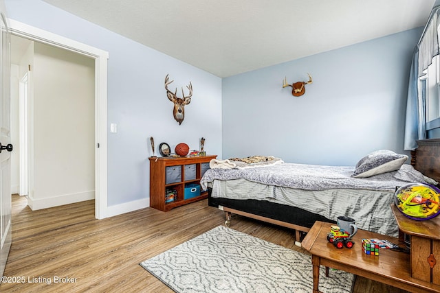 3412 Boyds Knob Rd, Munfordville, KY 42765 - bedroom featuring light wood-style floors and baseboards