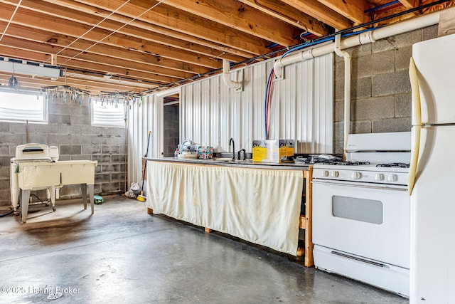 3412 Boyds Knob Rd, Munfordville, KY 42765 - below grade area featuring freestanding refrigerator, a sink, and concrete block wall