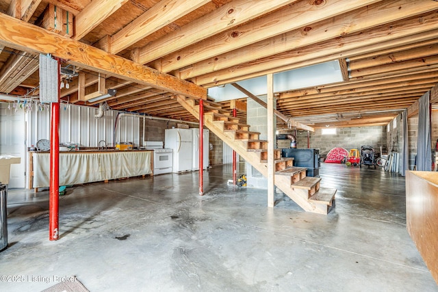 3412 Boyds Knob Rd, Munfordville, KY 42765 - unfinished basement featuring freestanding refrigerator and stairs