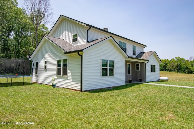 3412 Boyds Knob Rd, Munfordville, KY 42765 - rear view of property featuring a trampoline, roof with shingles, and a yard