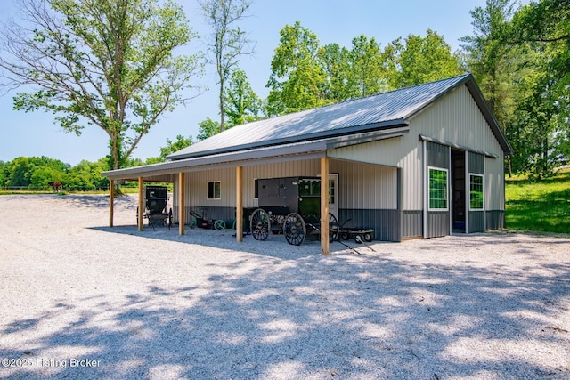 3412 Boyds Knob Rd, Munfordville, KY 42765 - view of property exterior featuring metal roof and a carport