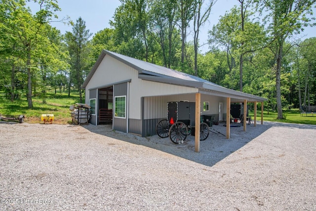 3412 Boyds Knob Rd, Munfordville, KY 42765 - view of property exterior featuring a carport, an outdoor structure, and an exterior structure