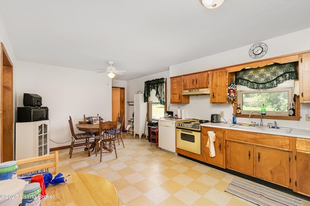 61 Dee St, Elizabethtown, KY 42701 - kitchen with white range oven, a sink, light countertops, light flooring, and under cabinet range hood