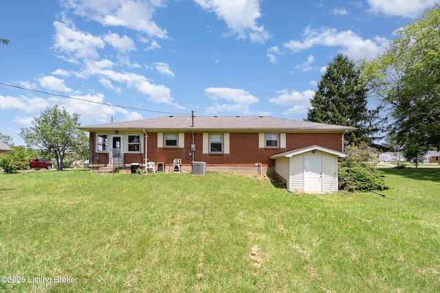 61 Dee St, Elizabethtown, KY 42701 - rear view of house featuring cooling unit, a yard, and brick siding