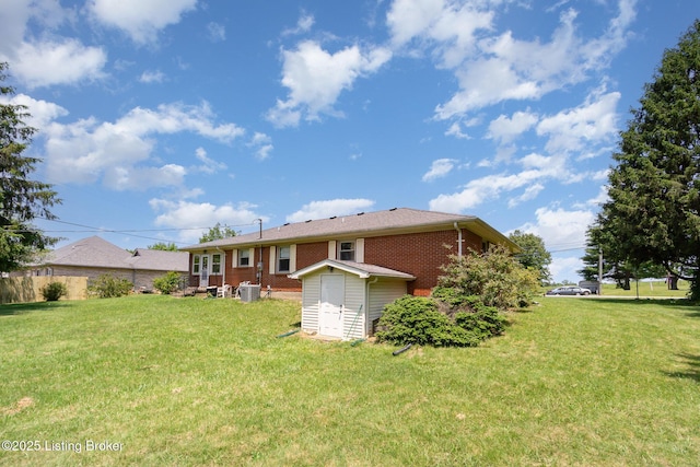 61 Dee St, Elizabethtown, KY 42701 - back of house featuring a yard, cooling unit, and brick siding