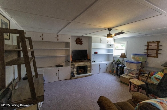 1972 Alice Dr, Lexington, KY 40511 - living room featuring ceiling fan, built in shelves, and a stone fireplace
