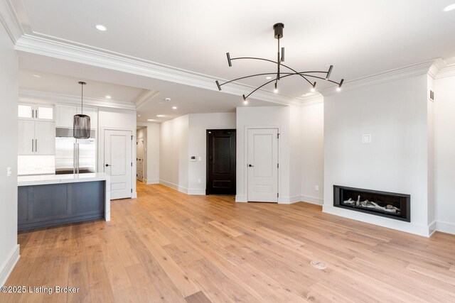 1576 Cherokee Rd Unit 1, Louisville, KY 40205 - unfurnished living room with a chandelier, light wood-style flooring, ornamental molding, baseboards, and recessed lighting