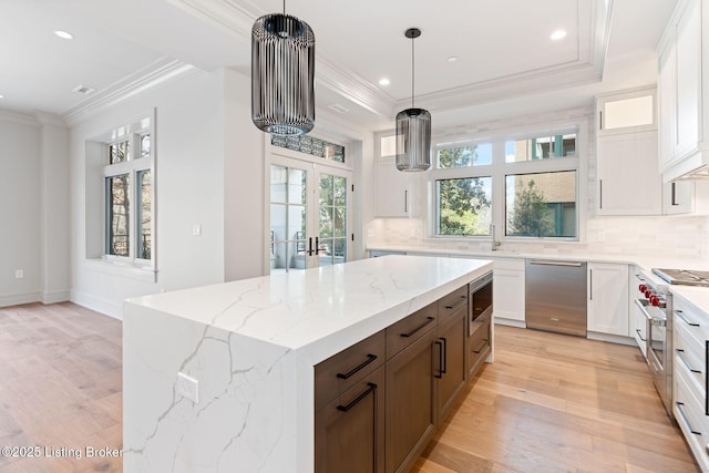 1576 Cherokee Rd Unit 1, Louisville, KY 40205 - kitchen featuring stainless steel appliances, light wood-style floors, crown molding, white cabinetry, and recessed lighting
